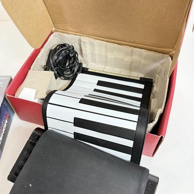 LOT 82: NIP Novelty & More: Light Bar+, Golden Girls Coasters, Roll-up Piano & More