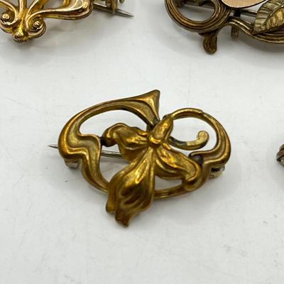 LOT 105: Collection of Antique Watch Fob Pins