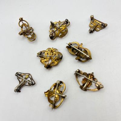 LOT 105: Collection of Antique Watch Fob Pins