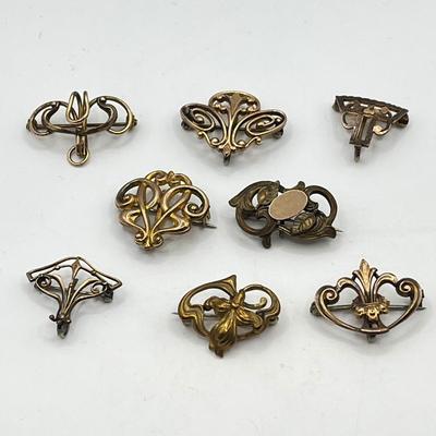 LOT 105: Collection of Antique Watch Fob Pins