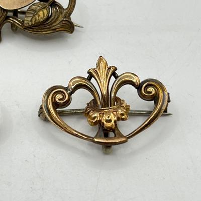 LOT 105: Collection of Antique Watch Fob Pins