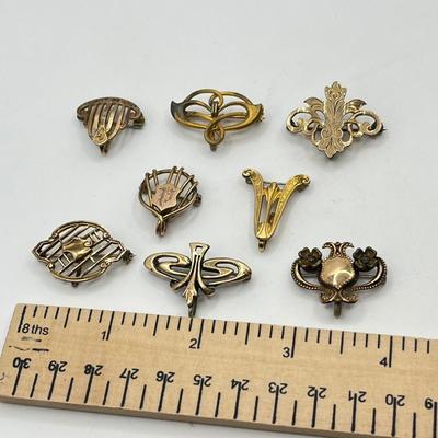 LOT 111: Collection of Antique Watch Fob Pins