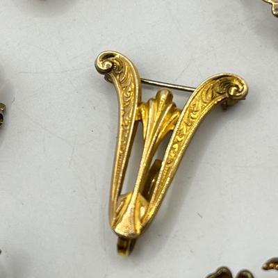 LOT 111: Collection of Antique Watch Fob Pins