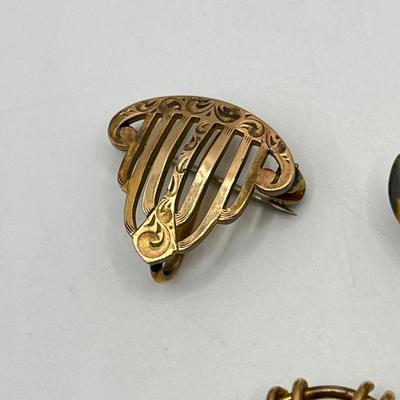 LOT 111: Collection of Antique Watch Fob Pins