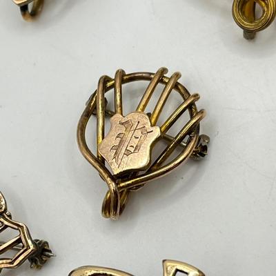 LOT 111: Collection of Antique Watch Fob Pins