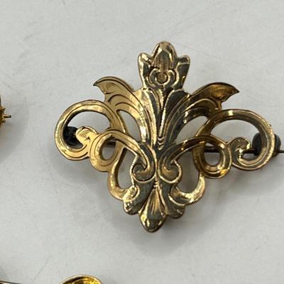 LOT 111: Collection of Antique Watch Fob Pins