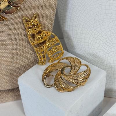 LOT 127: Gold Tone Necklaces, Brooches & Elizabeth Taylor Watch