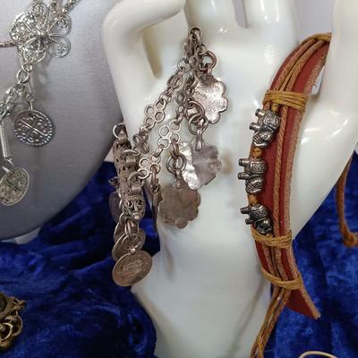 LOT 145: Moroccan Pendants, Bracelets, Belt & More