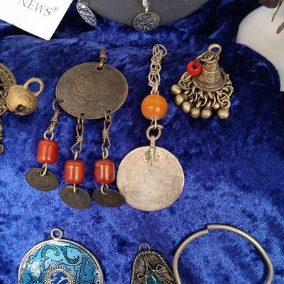 LOT 145: Moroccan Pendants, Bracelets, Belt & More
