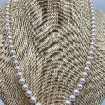 Knotted strand of pearls with 14k clasp