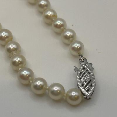 Knotted strand of pearls with 14k clasp