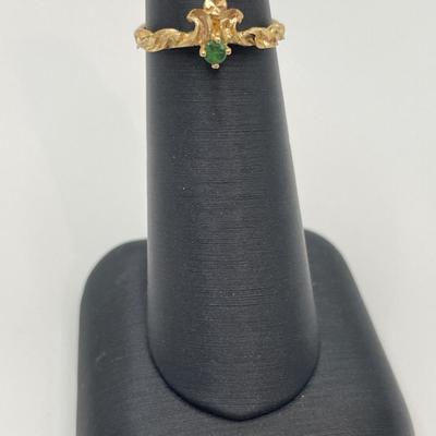 14k gold ring with small green stone, possible emerald