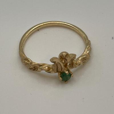14k gold ring with small green stone, possible emerald