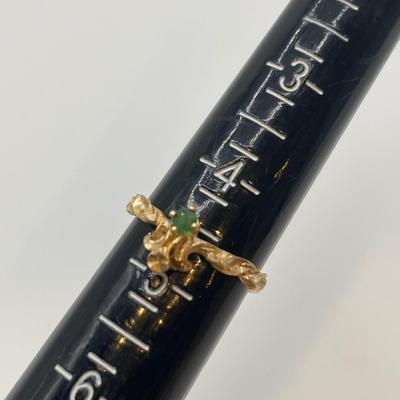 14k gold ring with small green stone, possible emerald