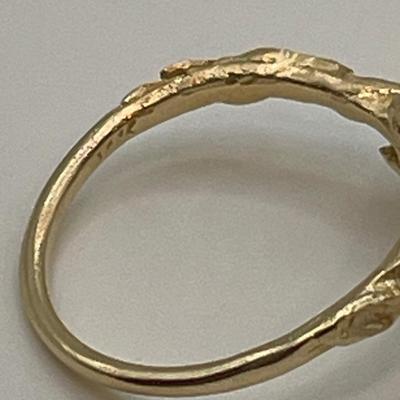 14k gold ring with small green stone, possible emerald