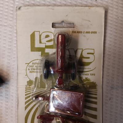 4 PIECE MINI FARM SET TOY AND 2 IMPLEMENTS