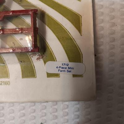 4 PIECE MINI FARM SET TOY AND 2 IMPLEMENTS