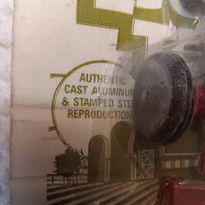 4 PIECE MINI FARM SET TOY AND 2 IMPLEMENTS