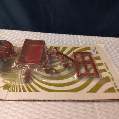 4 PIECE MINI FARM SET TOY AND 2 IMPLEMENTS