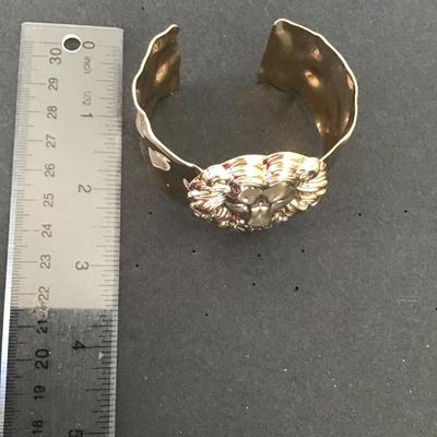 Very nice gold tone lion cuff bracelet
