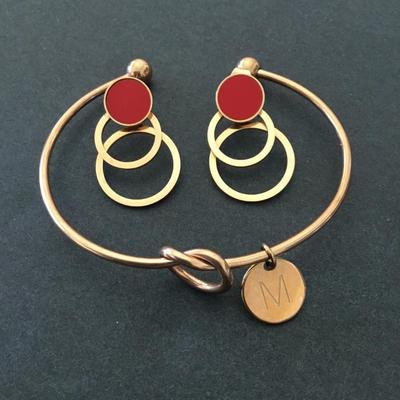 Cute copper, toned, knotted cuff, bracelet, and earrings set