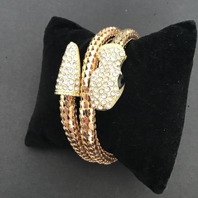 Very cool gold tone tube type snake bracelet