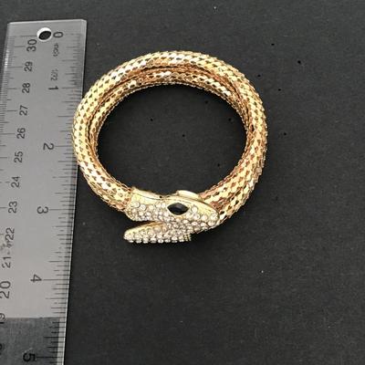 Very cool gold tone tube type snake bracelet