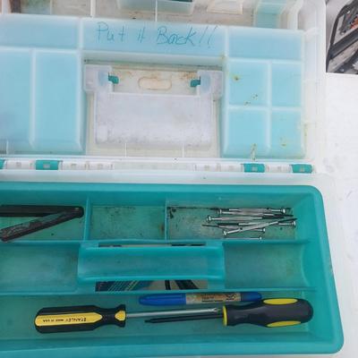 plastic toolbox with a few tools.
