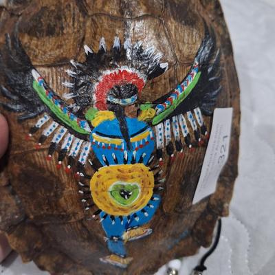 Native American-style art painted on a large turtle shell