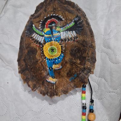 Native American-style art painted on a large turtle shell