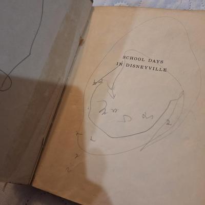  two vintage children's books, one titled School Days in Disney Ville and the other Boo the Little Indian. 
