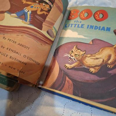  two vintage children's books, one titled School Days in Disney Ville and the other Boo the Little Indian. 
