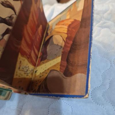  two vintage children's books, one titled School Days in Disney Ville and the other Boo the Little Indian. 