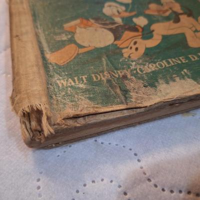  two vintage children's books, one titled School Days in Disney Ville and the other Boo the Little Indian. 