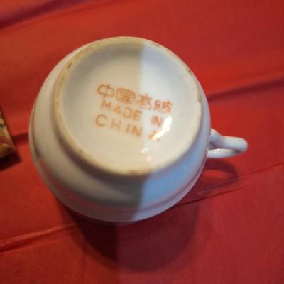 vintage demitasse teacup and saucer blue floral and gold trim