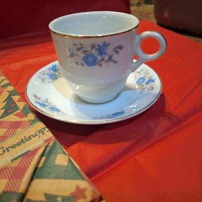vintage demitasse teacup and saucer blue floral and gold trim