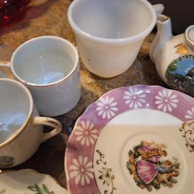 mismatched teacups and saucers