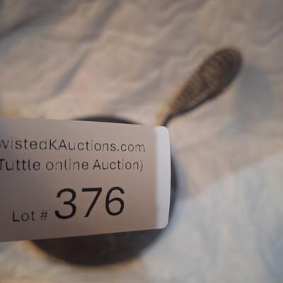 cast iron trivet and handle to remove it from stove