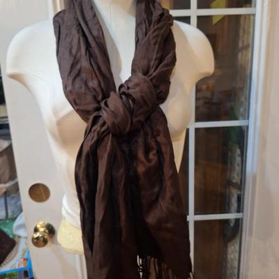 lightweight brown scarm with fringe on the ends