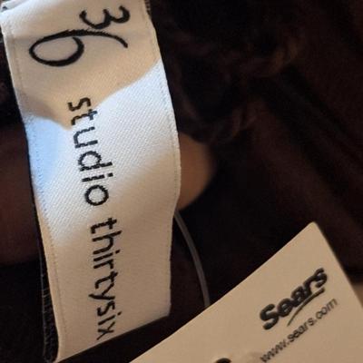 lightweight brown scarm with fringe on the ends