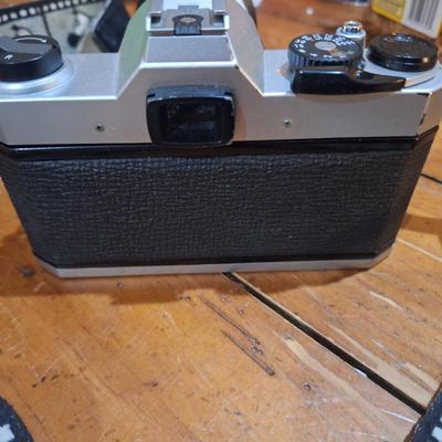 vintage Pentax K1000 35mm film with a 50mm vivitar lens and mickey mouse strap