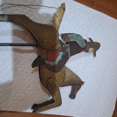 vintage folk art metal cowboy on a bucking horse pendulum balancing toy