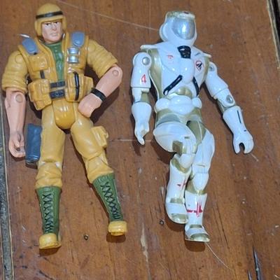 2 small action figures:1994 vanard the corps star force sapper astronaut figure on the right and GI joe action figure on the left from 2002