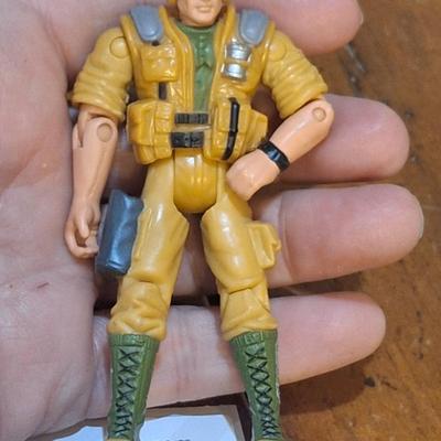 2 small action figures:1994 vanard the corps star force sapper astronaut figure on the right and GI joe action figure on the left from 2002