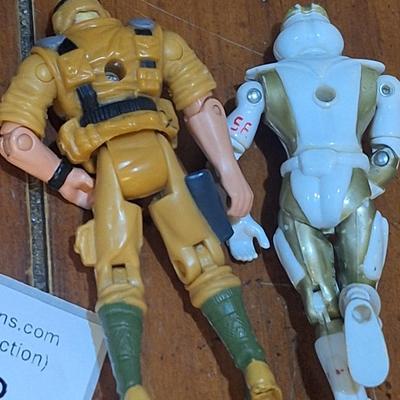 2 small action figures:1994 vanard the corps star force sapper astronaut figure on the right and GI joe action figure on the left from 2002