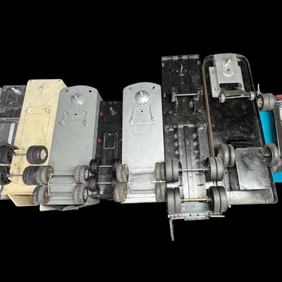 Sale Photo Thumbnail #313: Includes Buddy L, Ertl, Structo, and more. Total of ten pieces. Some are pressed steel. There is age and use related wear, and some pieces may have minor missing parts. Measurement of longest: 21”L. [VY]