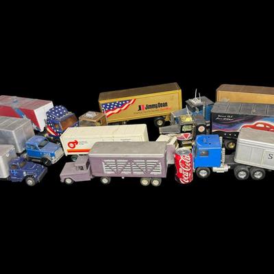 Sale Photo Thumbnail #318: Includes Structo, Tonka, Nylint, and more. Total of nine pieces. There is age and use related wear, and there may or may not be missing accessories. Measurement of longest: 24”L. [VY]