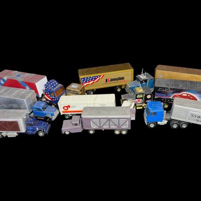 Sale Photo Thumbnail #317: Includes Structo, Tonka, Nylint, and more. Total of nine pieces. There is age and use related wear, and there may or may not be missing accessories. Measurement of longest: 24”L. [VY]