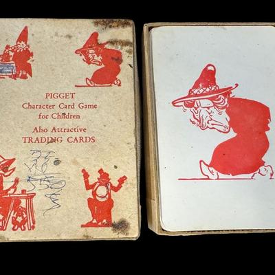 Sale Photo Thumbnail #349: Includes a wooden juvenile accordion, a vintage Colt .45 diecast cap gun, and a “Pigget” character card game. The bellows are intact on the accordion. All pieces have age related wear. Not tested. Measurement of accordion: 9”L (approximate). [SR]