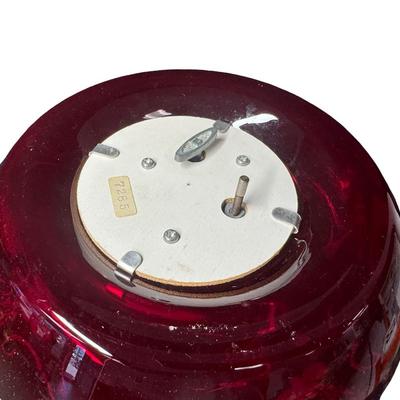 Sale Photo Thumbnail #360: Includes a decanter with a music box in the base, and six cups. It features extensive gold overlay with enamel floral designs. Most likely mid-century. No obvious chips or cracks. The music box appears to be overwound. Measurement of decanter: 13.5”H. [